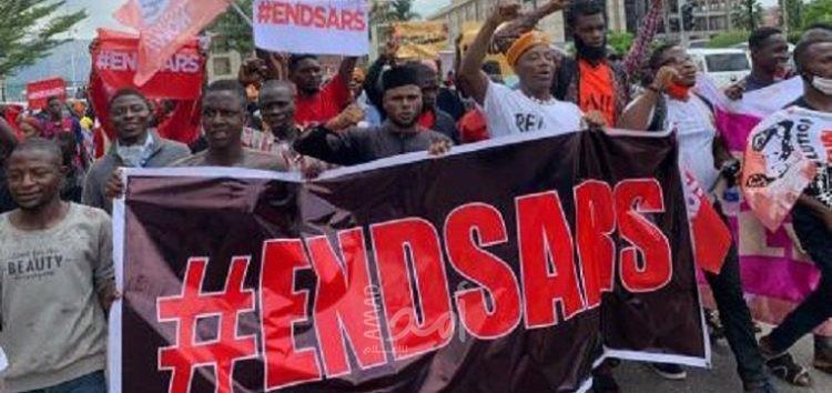 Nigerians take to the streets in mass protests against controversial police unit accused of brutality