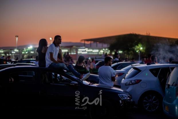 فلسطينيون يحضرون مهرجانا للموسيقى من داخل سياراتهم في ظل تدابير "كورونا"