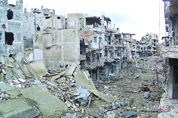 تلفزيون:انفجار سيارتين ملغومتين بوسط سوريا ومقتل 18 شخصا