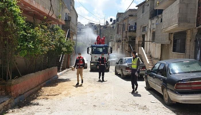 مديرية الدفاع المدني برام الله تقيم حملة تعقيم بالجلزون - صور