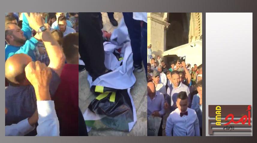 (فيديو) جماهير غاضبة تزيل صورة لعباس وماجد فرج من مدخل الاقصى