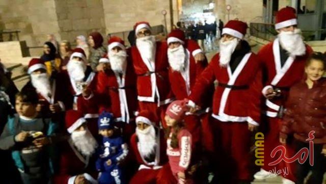 بالصور.. التجمع الوطني المسيحي يحيي عيد الميلاد في شوارع القدس