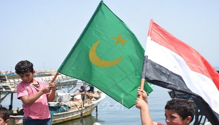 نشطاء غزيون يتضامنون مع الإنسانية في مواجهة "جائحة كورونا"- فيديو وصور